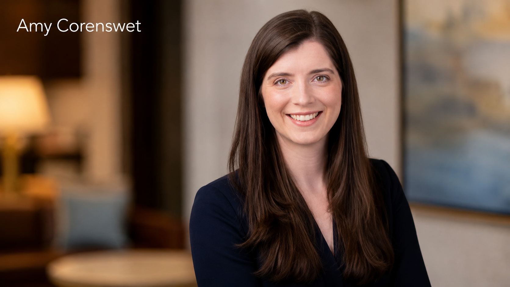 Amy Corenswet professional portrait in a modern office setting