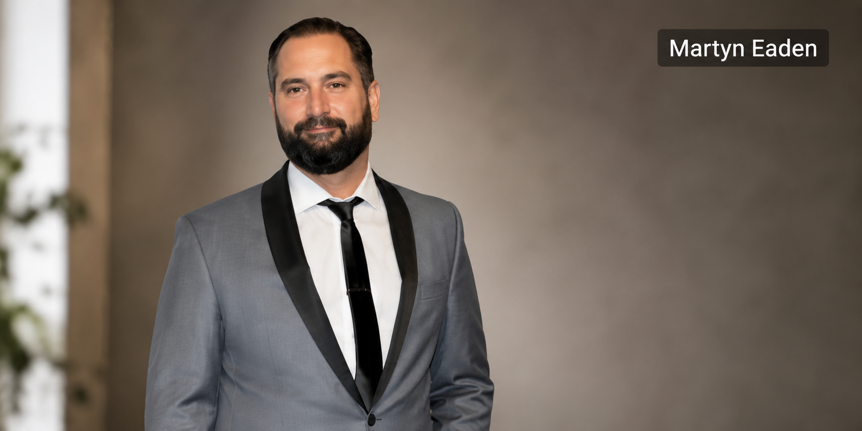 Martyn Eaden wearing a grey suit in a professional portrait